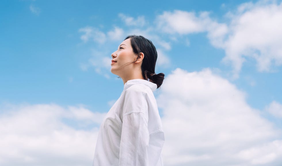 Side profile of confident smiling woman side profile of confident smiling woman