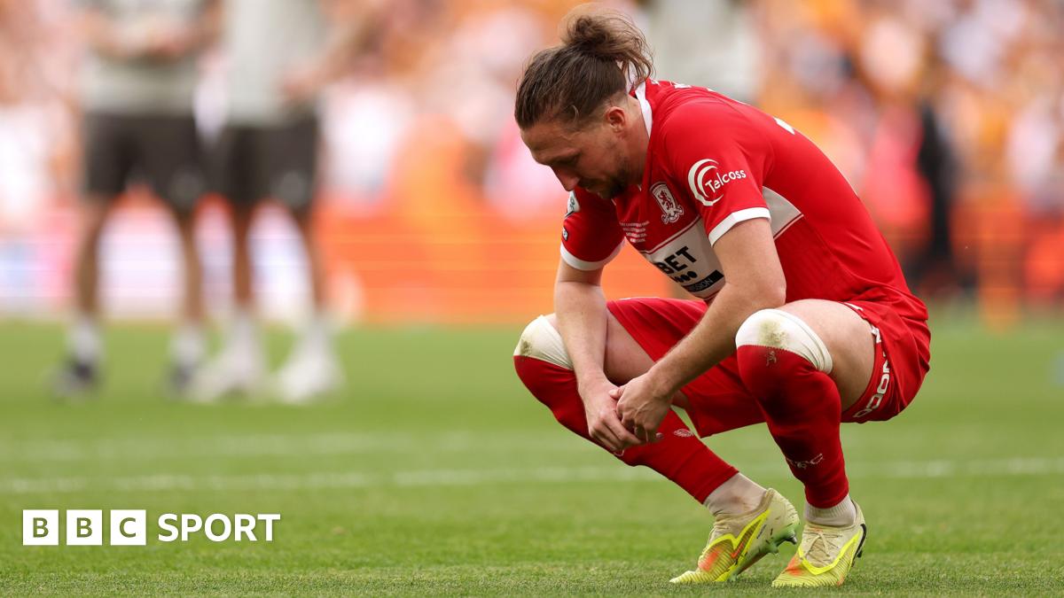 Luke Ayling alone in his thoughts and staring at the floor after Middlesbrough's play-off final defeat to Hull