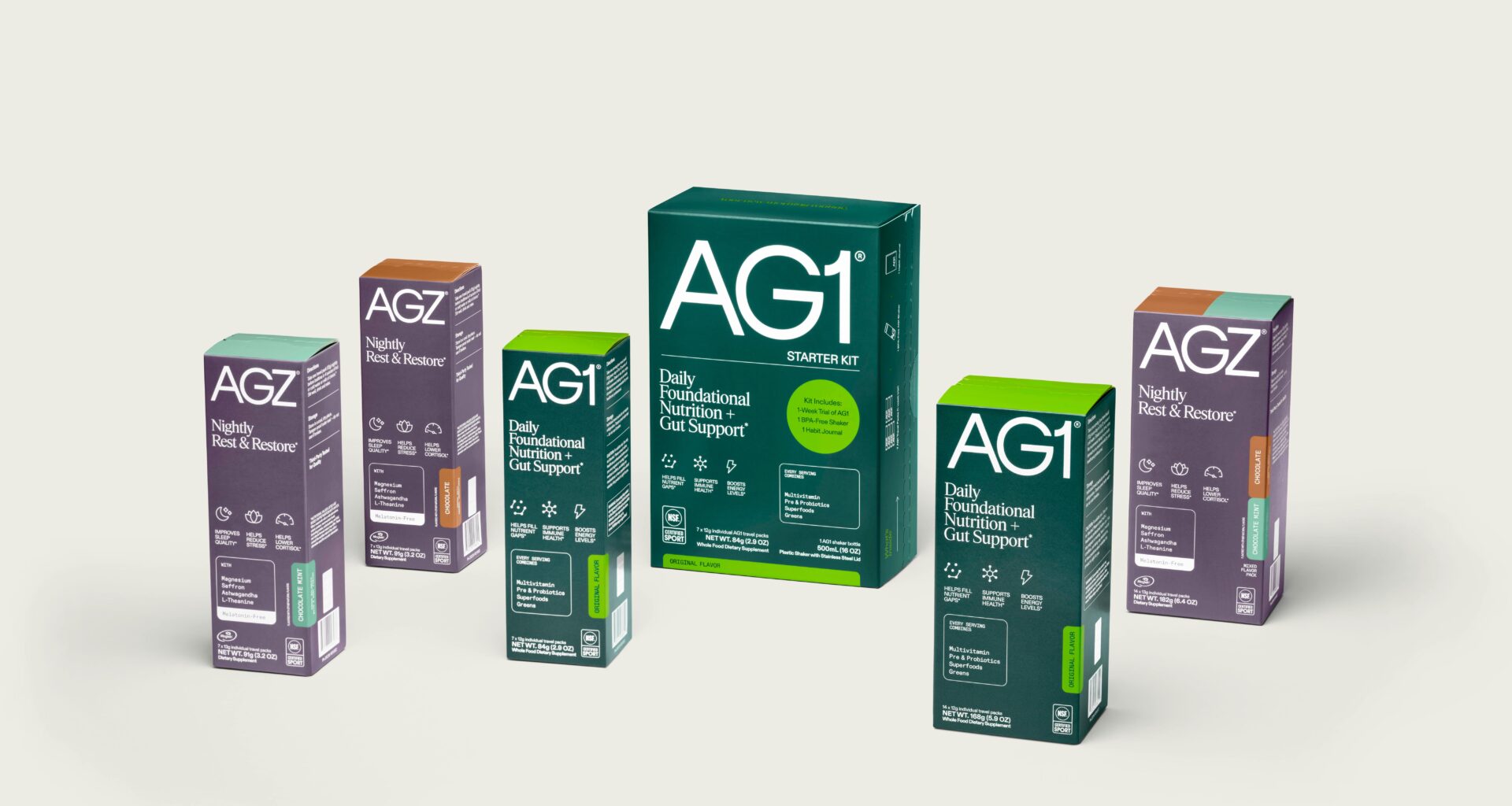Multiple boxes of AG1 and AGZ wellness supplements arranged against a neutral background