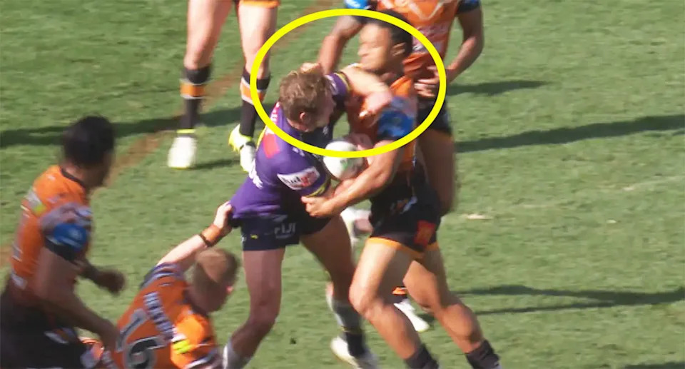 Storm captain Harry Grant was not penalised after raising his forearm into the head of Latu Fainu during a tackle by the Tigers player. Pic: Fox League