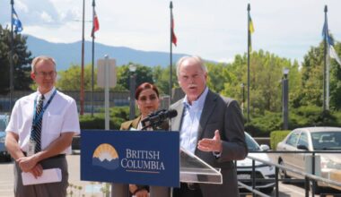 Vernon Mayor Victor Cumming (right) speaks at an announcement of the expansion of the HealthIM screening tool throughout the Interior at a press conference outside the Vernon RCMP detachment Friday, May 22, 2026. (Brendan Shykora/Morning Star)