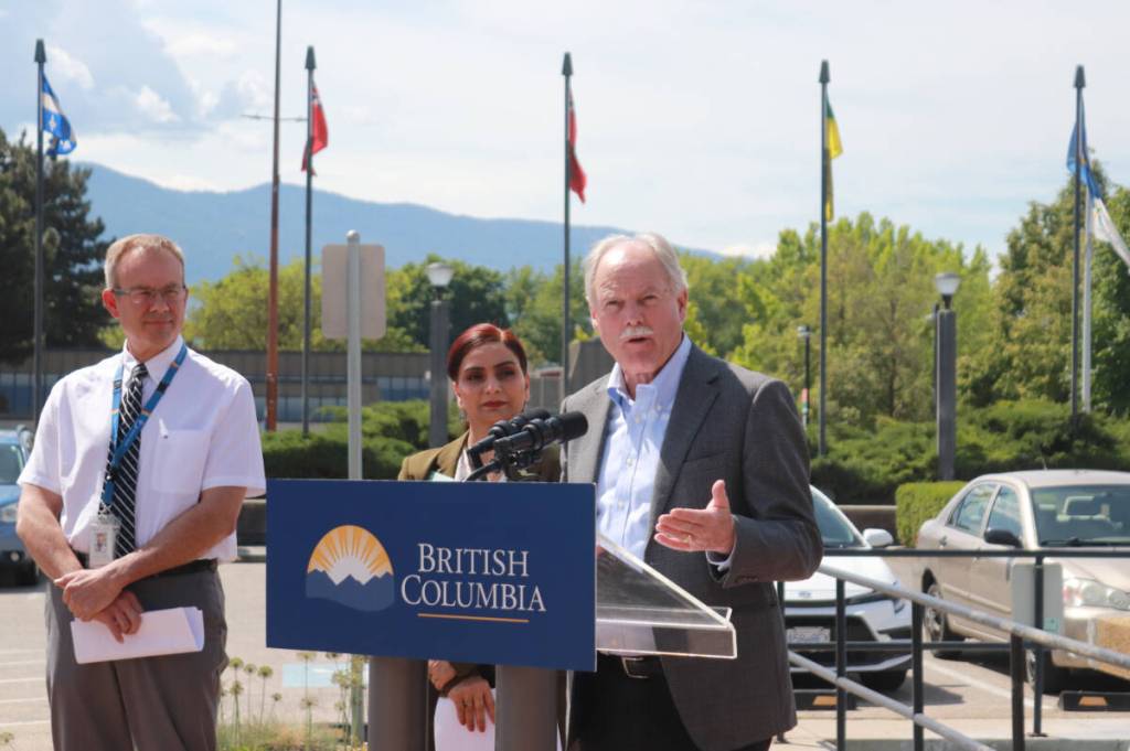 Vernon Mayor Victor Cumming (right) speaks at an announcement of the expansion of the HealthIM screening tool throughout the Interior at a press conference outside the Vernon RCMP detachment Friday, May 22, 2026. (Brendan Shykora/Morning Star)