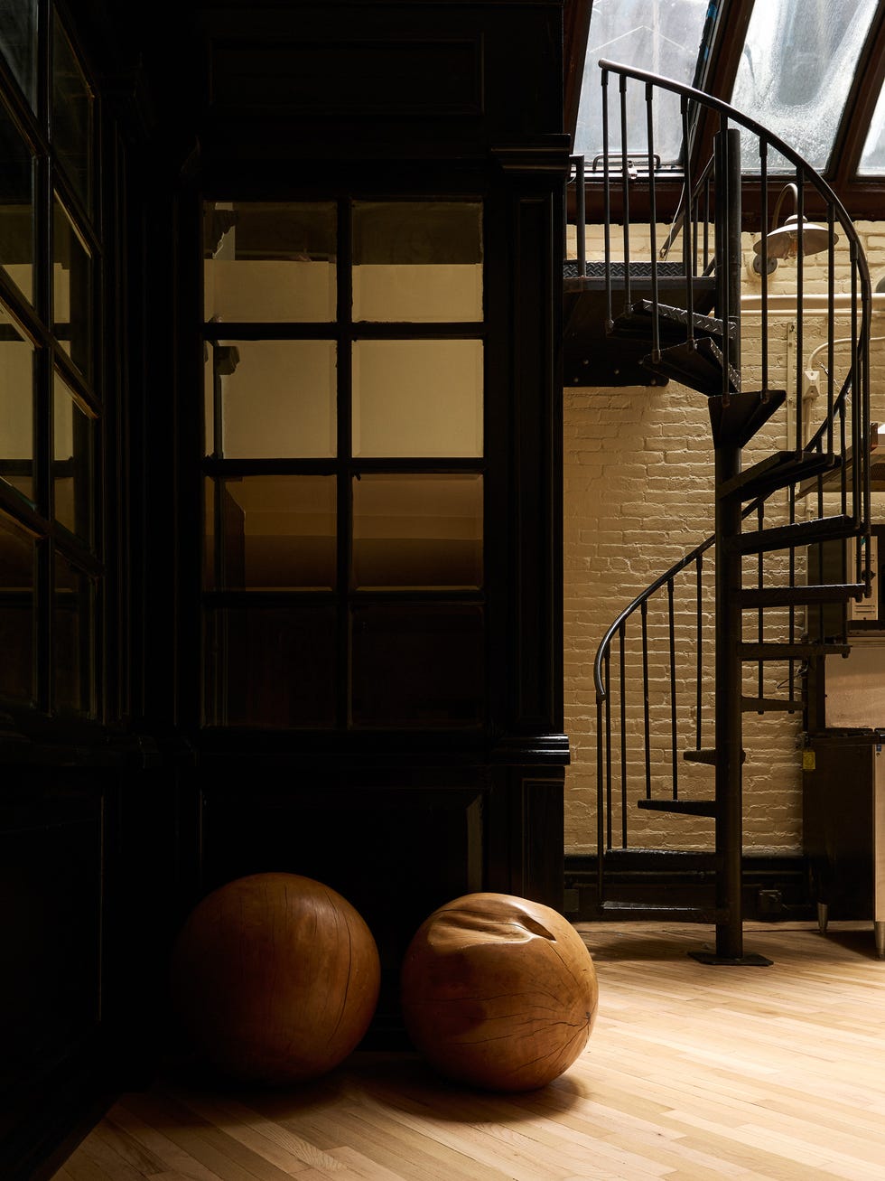 Interior space featuring a spiral staircase and wooden elements.