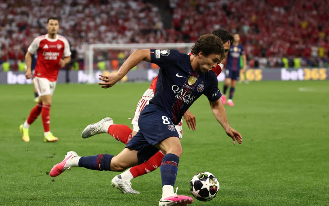 Paris Saint-Germain's Portuguese midfielder #87 Joao Neves and Arsenal's Spanish defender #36 Martin Zubimendi (back) fight for the ball during the UEFA Champions League final football match between Paris Saint-Germain (PSG) and Arsenal FC at the Puskas Arena in Budapest on May 30, 2026. (Photo by FRANCK FIFE / AFP)