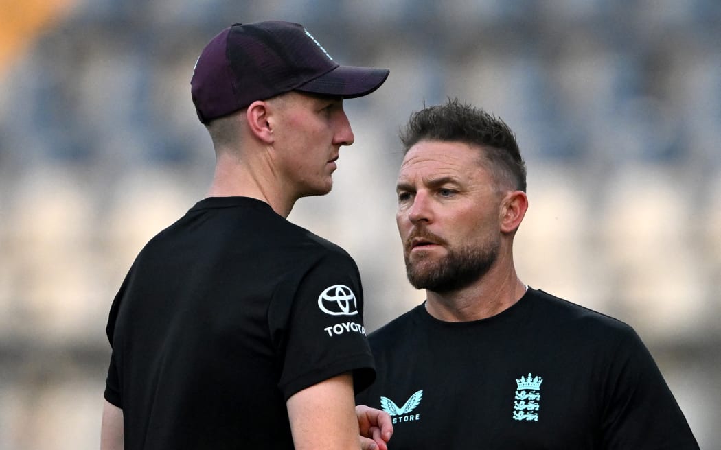 England’s captain Harry Brook (L) interacts with team head coach Brendon McCullum during the training session on the eve of their 2026 ICC Men's T20 Cricket World Cup semi-final match against India at the Wankhede Stadium in Mumbai on March 4, 2026.