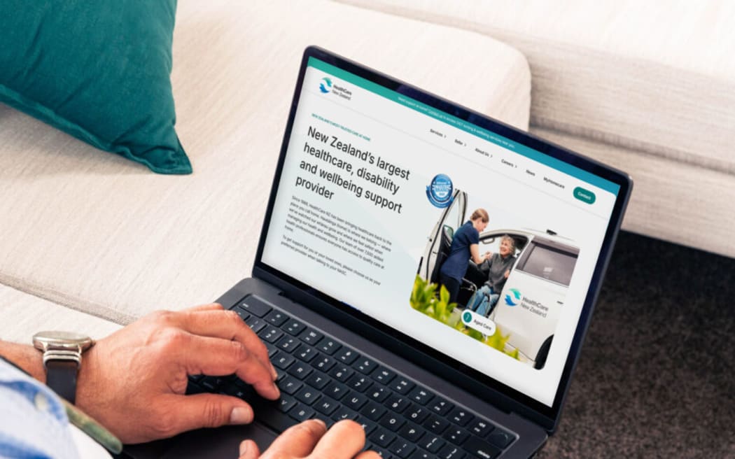 A man looks at the HealthCare NZ website.