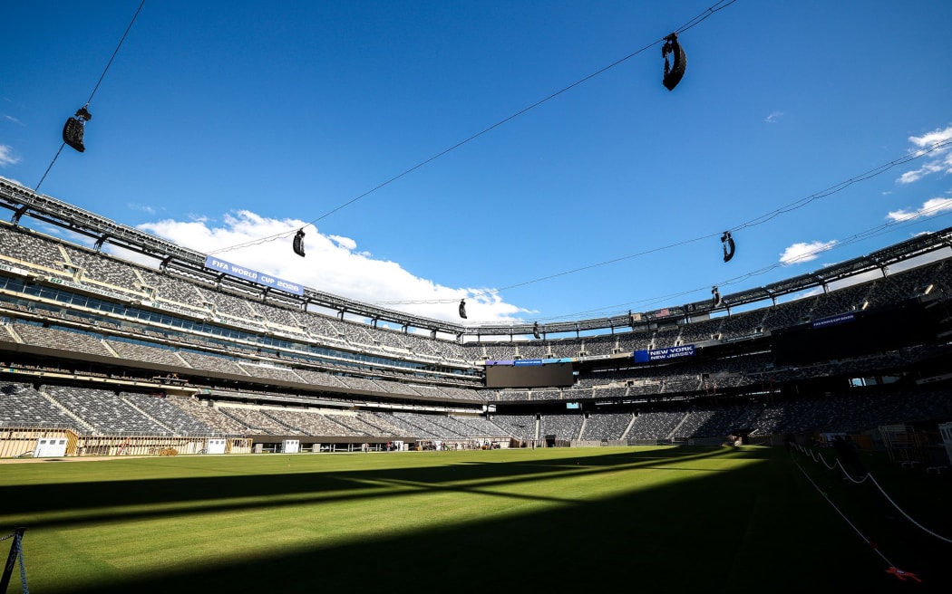 Workers install the pitch at New York New Jersey Stadium, which is temporarily renamed from MetLife stadium, ahead of the 2026 FIFA World Cup.
