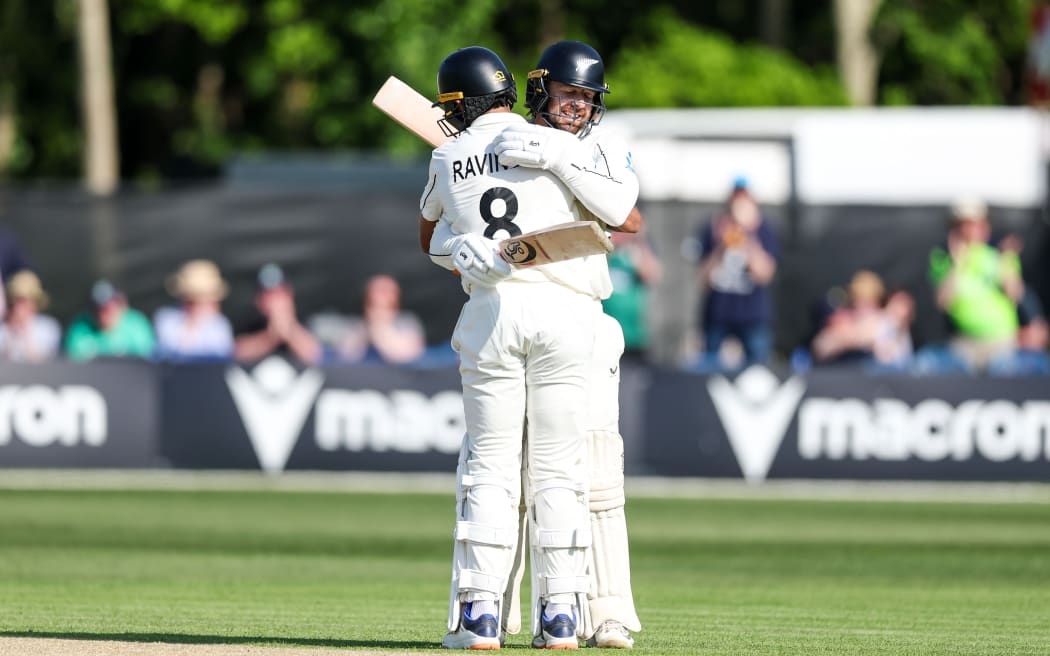 New Zealand’s Tom Blundel celebrates with Rachin Ravindra after scoring a century against Ireland, Belfast, 2026.