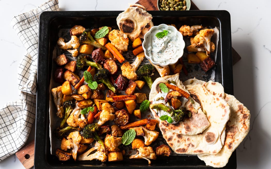 Honey and cumin roasted vegetables with flatbreads and garlic yoghurt.