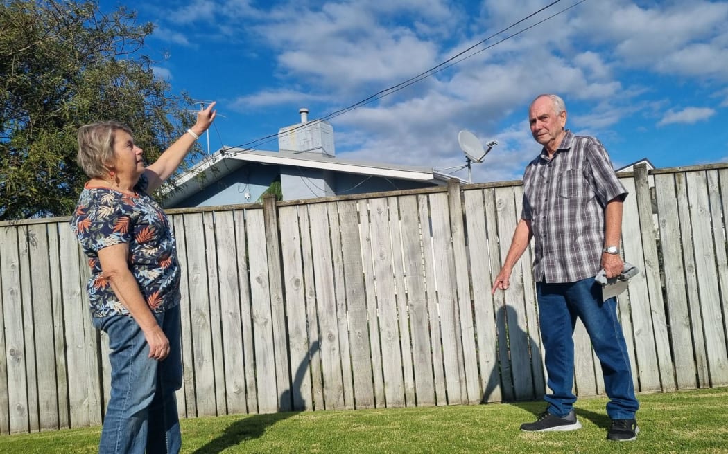 Neil and Judith Herdon believe a 15m high cellphone tower proposed to be built in the road reserve outside their Spotswood property will take thousands of dollars off its value.