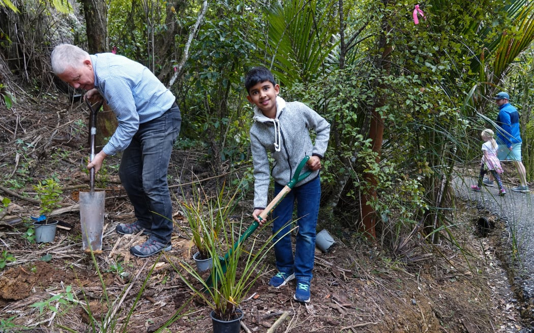 Eight-year-old Ayaan Jalan aids the replanting effort.