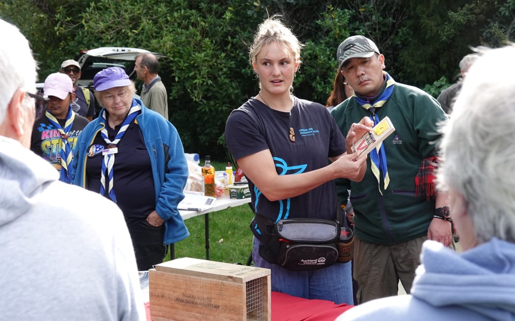 Nikita Jones of environmental group Urban Ark demonstrates a rat trap.