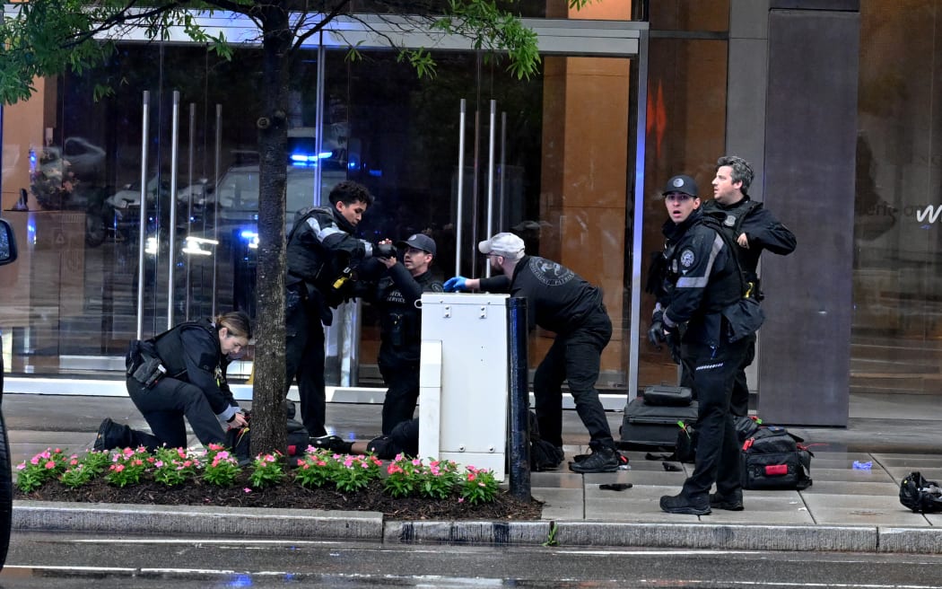 WASHINGTON, DC - MAY 23: Members of the U.S. Secret Service tend to a wounded man on the scene of a shooting near the White House on May 23, 2026 in Washington, DC. Emergency teams work the scene after multiple rapid-fire gunshots ring out outside the White House. President Trump was reportedly inside the White House working on a peace deal with Iran.   Roberto Schmidt/Getty Images/AFP (Photo by ROBERTO SCHMIDT / GETTY IMAGES NORTH AMERICA / Getty Images via AFP)