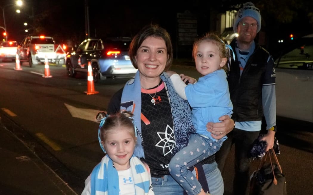 Eager fans enter the stadium for the grand final.