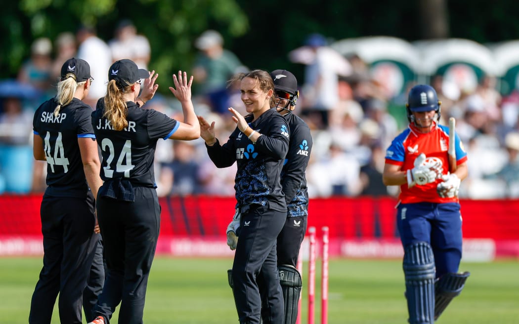 Melie Kerr of New Zealand celebrates taking the wicket of England's Alice Capsey.