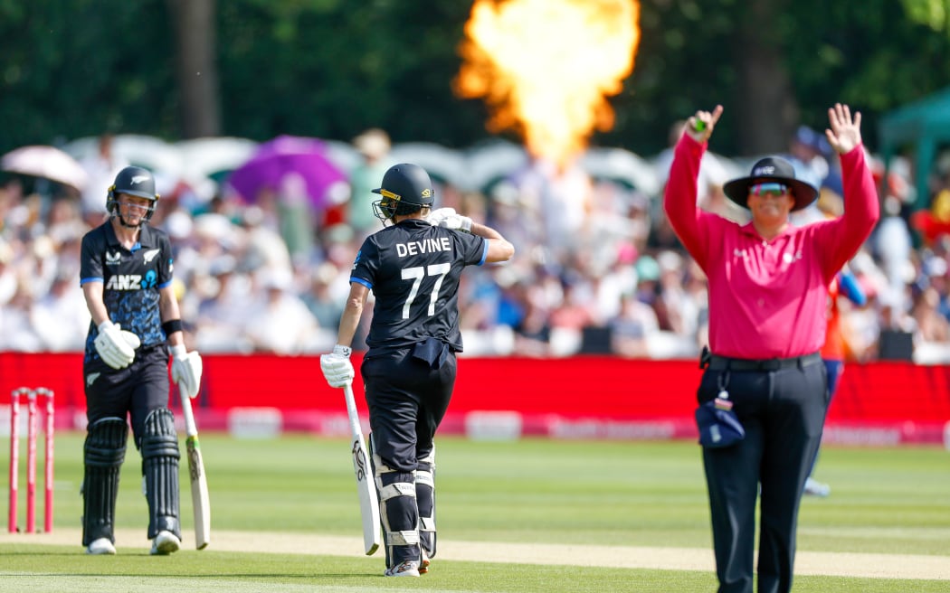 Sophie Devine of New Zealand hits a six against England.