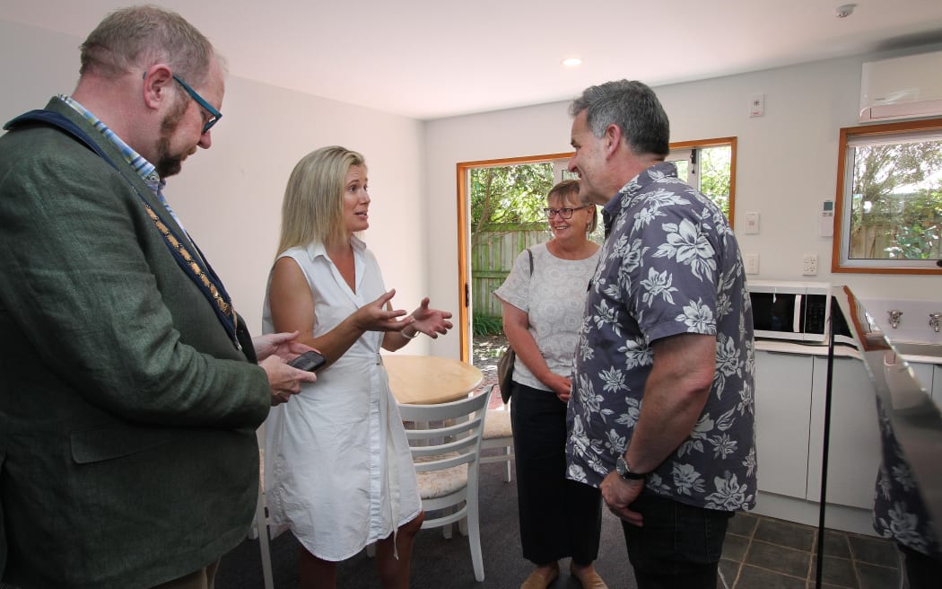 Cara Gullick (centre) explains her latest project to Waimakariri Mayor Dan Gordon (left) and councillors Shona Powell and Bruce McLaren at an opening earlier this year. Photo: North Canterbury News