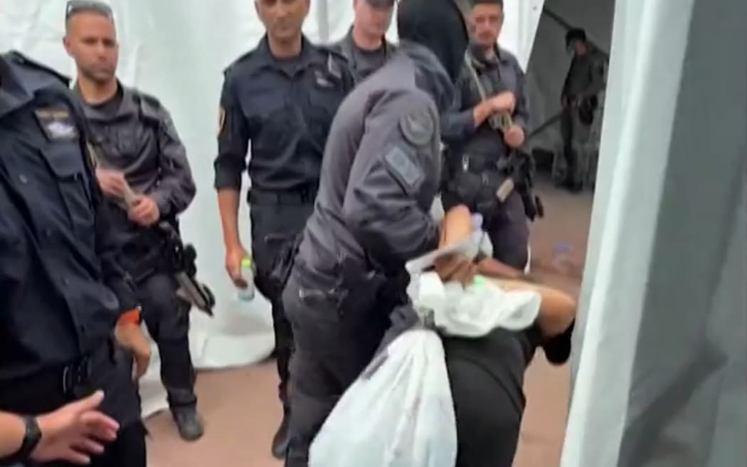 A screenshot from the video showing detained activists from a Gaza-bound flotilla.