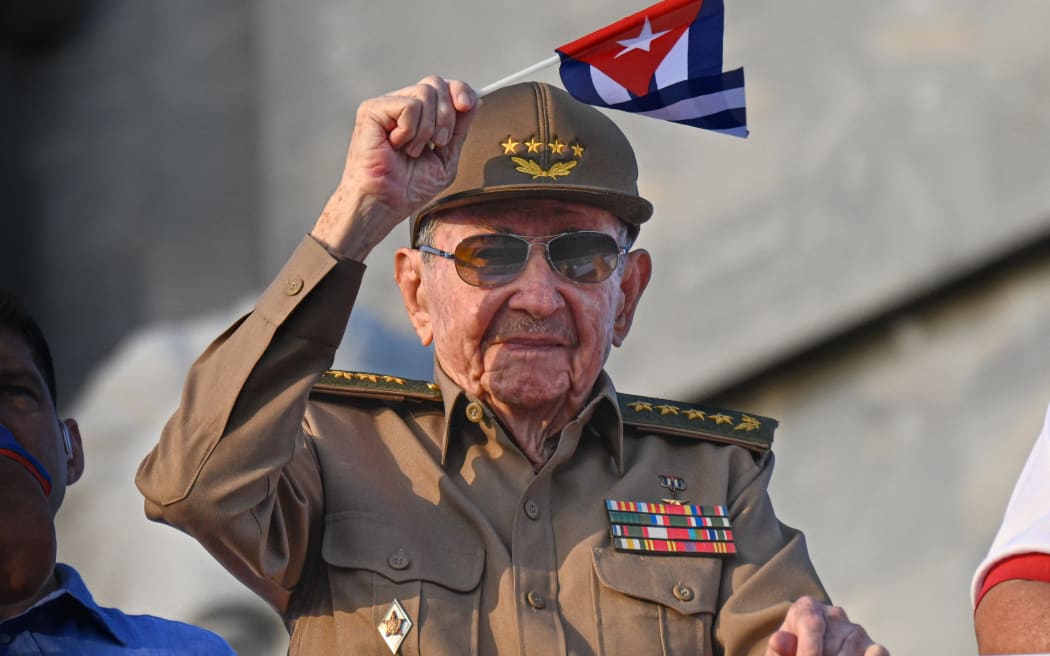 Cuba's former President Raul Castro waves a Cuban national flag during the commemoration of May Day (Labour Day), marking International Workers' Day, at Havana's Revolution Square on 1 May, 2025.