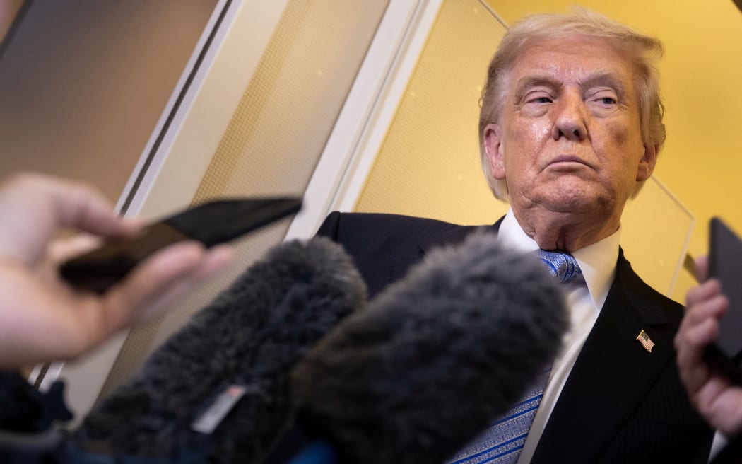 US President Donald Trump speaks to reporters aboard Air Force One after his departure from Beijing Capital Airport on May 15, 2026, on his way back to the United States. Trump said he had made "fantastic trade deals" with China's Xi Jinping, as the pair met on May 15 at final talks of a superpower summit that according to the US leader has also reaped a Chinese offer to help open the Strait of Hormuz.