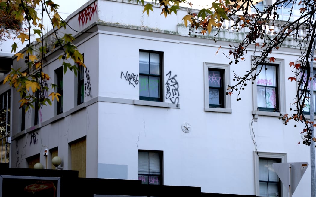 The trial of the owner of one of Auckland's oldest buildings has begun, five and a half years after an engineer first inspected cracks in its façade.