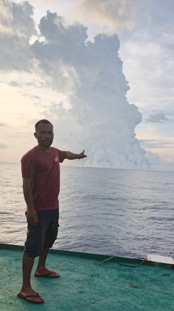 Kennedy Masis took in the spectacle from the fishing boat he was working on.