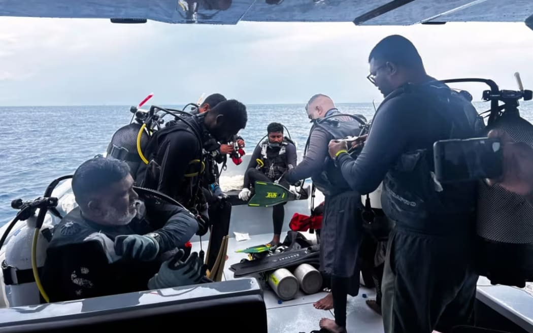 Divers prepare to search for the four missing Italian divers near Vaavu Atoll, Maldives, on May 15, 2026.