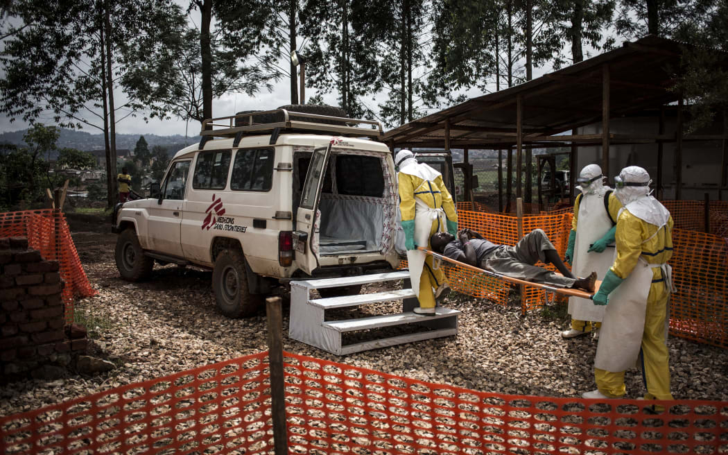 (FILES) Health workers move a patient to a hospital after he was cleared of having Ebola inside a MSF (Doctors Without Borders) supported Ebola Treatment Centre (ETC) on November 4, 2018 in Butembo, Democratic Republic of the Congo. An outbreak of the ebola virus has been blamed for dozens of deaths in the east of the Democratic Republic of the Congo, African health authorities said on May 15, 2026.
The outbreak is in Ituri province. (Photo by John WESSELS / AFP)