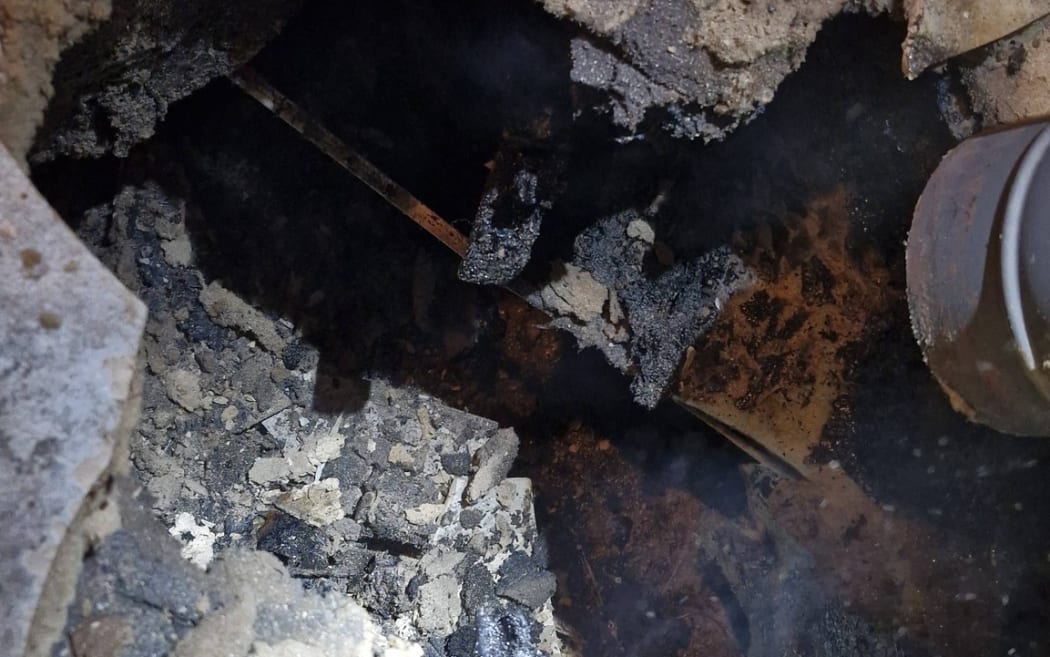 The fire underneath Annemarie van der Slot-Verhoeven's wood burner.