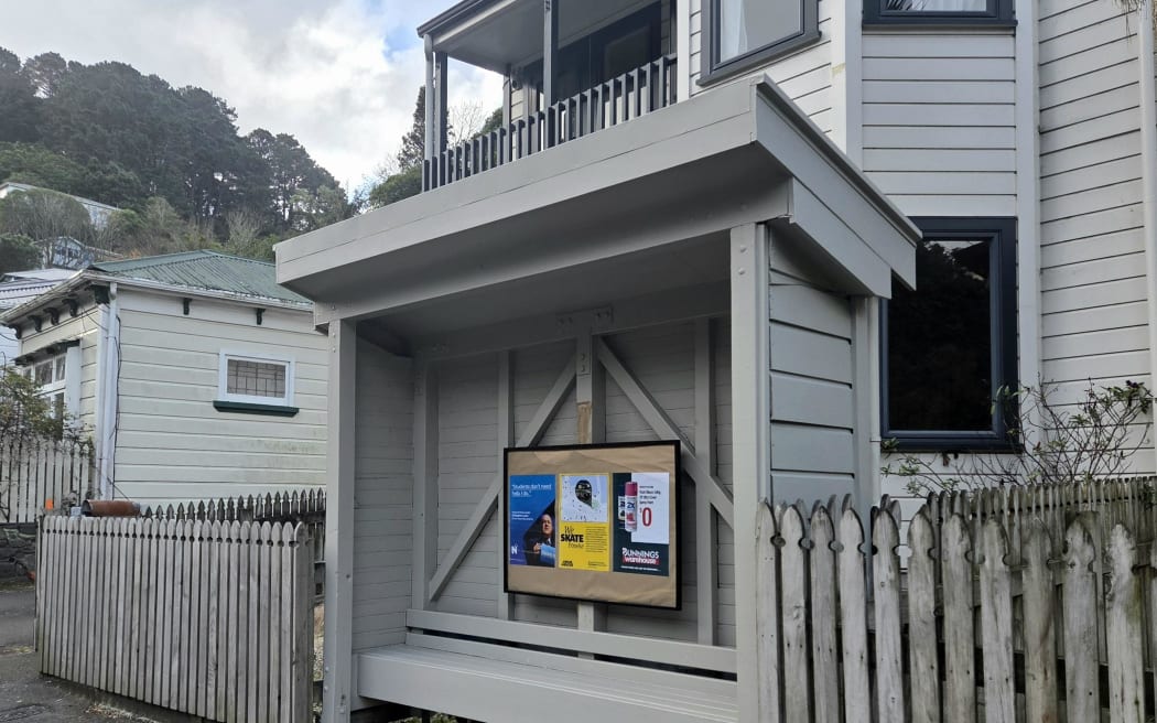 The bus stop on the Aro Street close to Raroa Road painted grey.