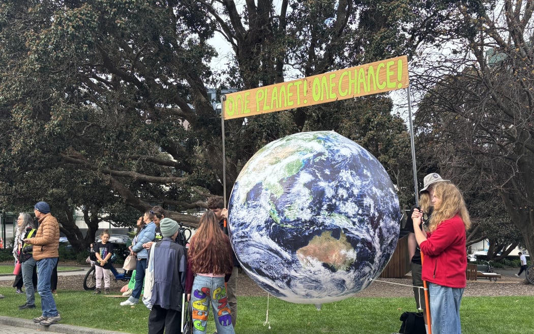 Hundreds of school students are gathered outside Parliament after marching through Wellington urging the government to take action against climate change.