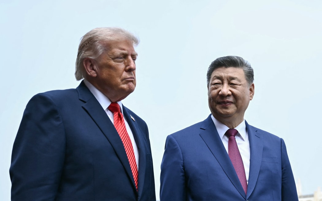China's President Xi Jinping (R) and US President Donald Trump visit the Temple of Heaven in Beijing on May 14, 2026. Xi warned Trump that the issue of Taiwan could push their two countries into "conflict" if mishandled, a stark opening salvo as a superpower summit set to tackle numerous thorny issues began in Beijing on May 14. (Photo by Brendan SMIALOWSKI / POOL / AFP)