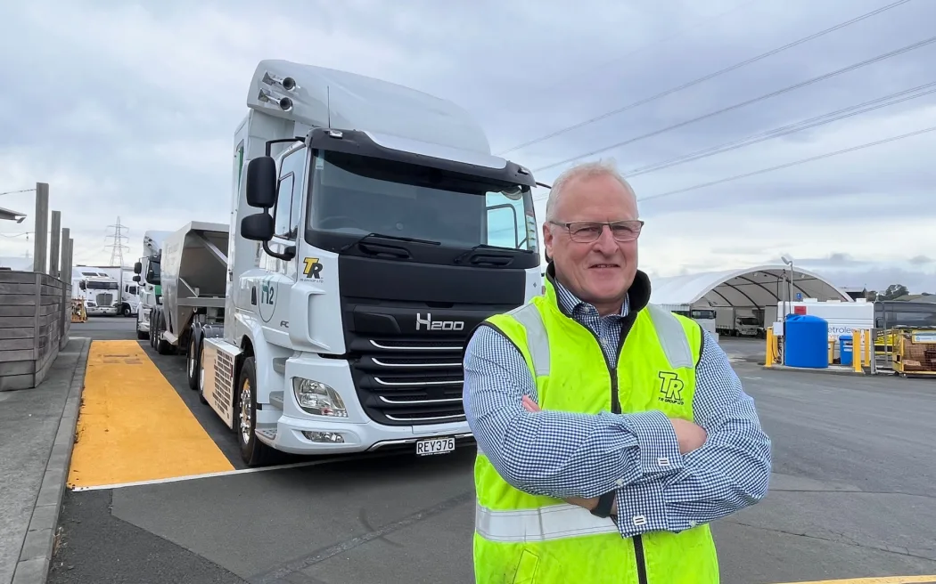 TR Group hydrogen fuel cell truck project manager Grant Doull stands in front of a hydrogen-powered truck at TR Group's Penrose depot in Auckland