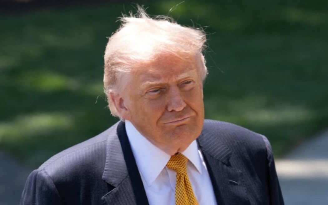 US President Donald Trump takes questions from reporters before departing on the first leg of his trip to China on May 12, 2026. (Photo by Andrew Leyden/NurPhoto) (Photo by Andrew Leyden / NurPhoto via AFP)