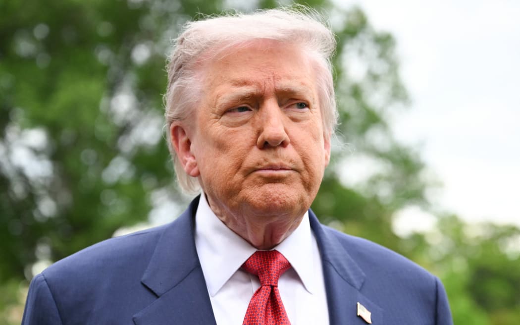 US President Donald Trump speaks to journalists as he makes his way to board Marine One before departing from the South Lawn of the White House in Washington, DC on May 8, 2026. Trump is traveling to Sterling, Virginia, where he will participate in a LIV Golf dinner.