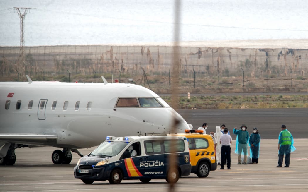 Turkish citizens prepare to board a plane bound for Turkey carrying passengers evacuated from the Dutch flagged hantavirus-stricken cruise ship MV Hondius at the Tenerife Sur-Reina Sofia airport on the island of Tenerife in Spain's Canary Islands on May 10, 2026. More than 90 of nearly 150 people on a cruise ship struck by a deadly hantavirus outbreak will have been evacuated by repatriation flights from the Canary Islands by the end of Sunday, Spanish authorities said.