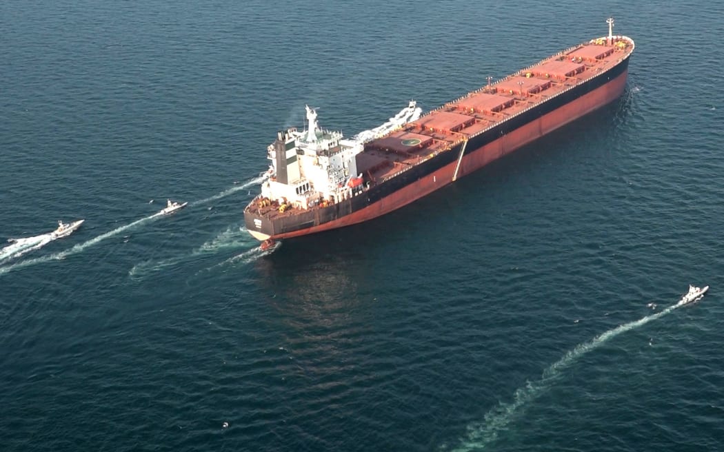 This handout photo released by Iran's Revolutionary Guards Corps (IRGC)'s official website Sepanews on February 17, 2026, shows boats manoeuvering around a tanker vessel during a military exercise by members of the IRGC and navy in the Strait of Hormuz. (Photo by SEPAH NEWS / AFP) / == RESTRICTED TO EDITORIAL USE - MANDATORY CREDIT "AFP PHOTO / HO / SEPAHNEWS" - NO MARKETING NO ADVERTISING CAMPAIGNS - DISTRIBUTED AS A SERVICE TO CLIENTS Boats maneuver around a tanker vessel during a military exercise by members of the IRGC and the navy in the Strait of Hormuz.==