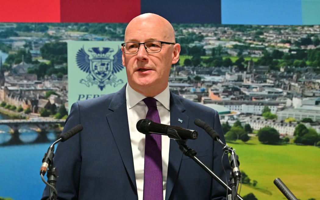Scotland's First Minister and Scottish National Party (SNP) leader John Swinney delivers a speech after winning his seat, at a vote-counting centre at the Dewars Centre in Perth, Perthshire, Scotland on May 8, 2026. (Photo by ANDY BUCHANAN / AFP)