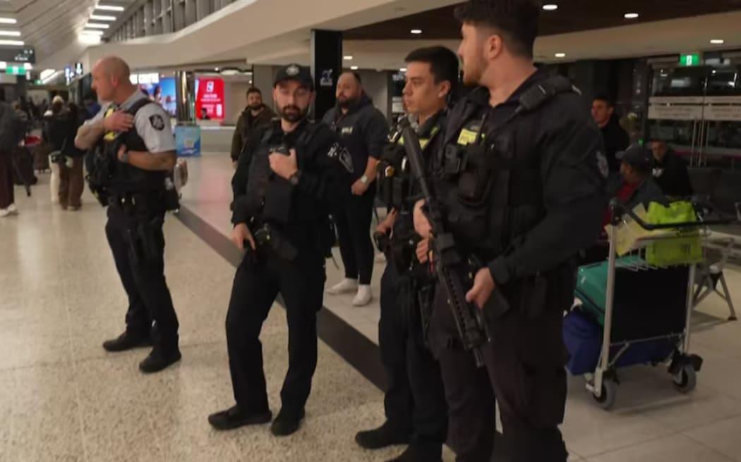 Heavily-armed police were on hand as the women emerged from the departure gate.