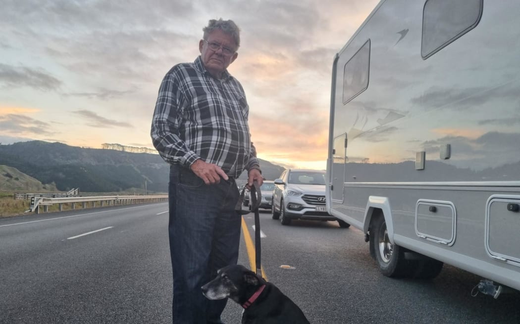 Bruce Belcher and Monty took the opportunity to stretch their legs ahead of their convoy leaving Awakino.