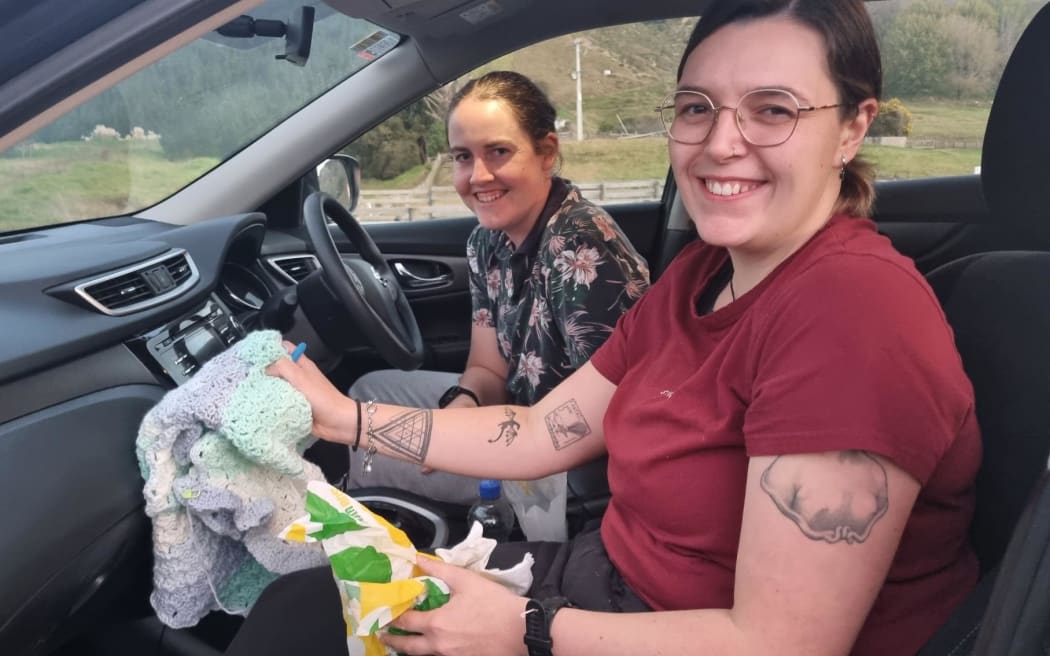 Caitlin Barnfather, left, and Abby Kewin came prepared with dinner and crochet.