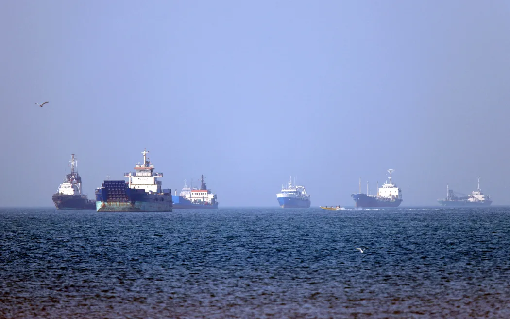 In this picture obtained from Iran's ISNA news agency on May 4, 2026, vessels are pictured anchored in the Strait of Hormuz off Bandar Abbas in southern Iran. Iran's Revolutionary Guards on May 4 denied that any commercial ships had crossed the Strait of Hormuz, after the US military earlier said two US-flagged merchant vessels had transited through the vital waterway. (Photo by Amirhossein KHORGOOEI / ISNA / AFP) /