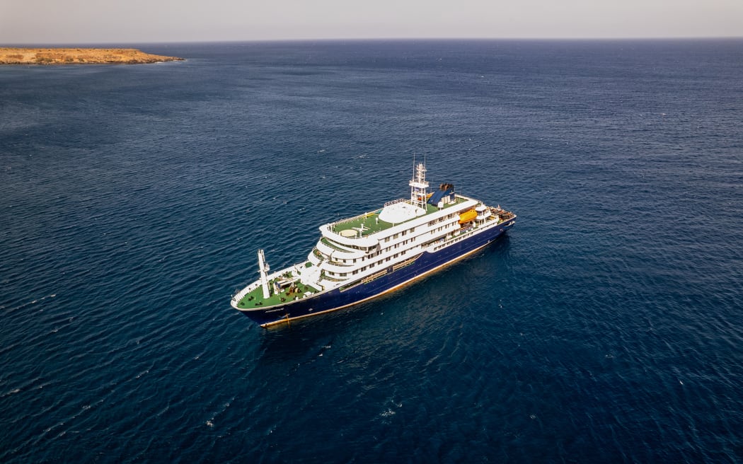 This aerial picture shows a general view of the cruise ship MV Hondius stationary off the port of Praia, the capital of Cape Verde, on May 3, 2026. An outbreak of "severe acute respiratory illness" on board a cruise ship in the Atlantic has left two people dead and a third in intensive care in Johannesburg, South Africa's health ministry told AFP on May 3, 2026.
The outbreak occurred on the MV Hondius, travelling from Ushuaia in Argentina to Cape Verde. The patient being treated in Johannesburg tested positive for a hantavirus, a family of viruses that can cause hemorrhagic fever, South African spokesperson Foster Mohale said. (Photo by AFP)