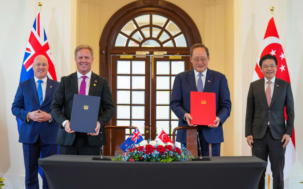 (L-R) NZ Prime Minister Christopher Luxon, Trade Minister Todd McClay, Singaporean Minister-in-charge of Energy, Science & Technology Dr Tan See Leng and Singaporean Prime Minister Lawrence Wong.