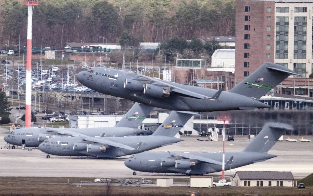 27 March 2026, Rhineland-Palatinate, Ramstein: A Boeing C-17 Globemaster III military transport aircraft takes off from the US airbase in Ramstein. Global conflicts spill over into Rhineland-Palatinate, as the USA has large logistics hubs here. Photo: Boris Roessler/dpa (Photo by BORIS ROESSLER / dpa Picture-Alliance via AFP)
