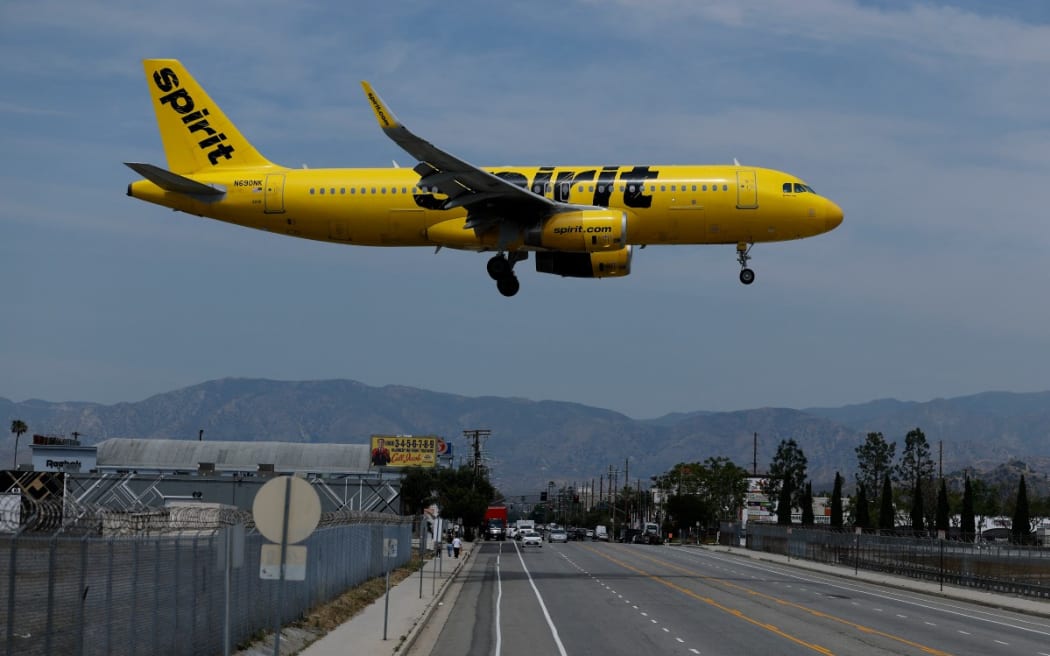 A Spirit Airlines plane lands at Hollywood Burbank Airport, California, on 16 April, 2026.