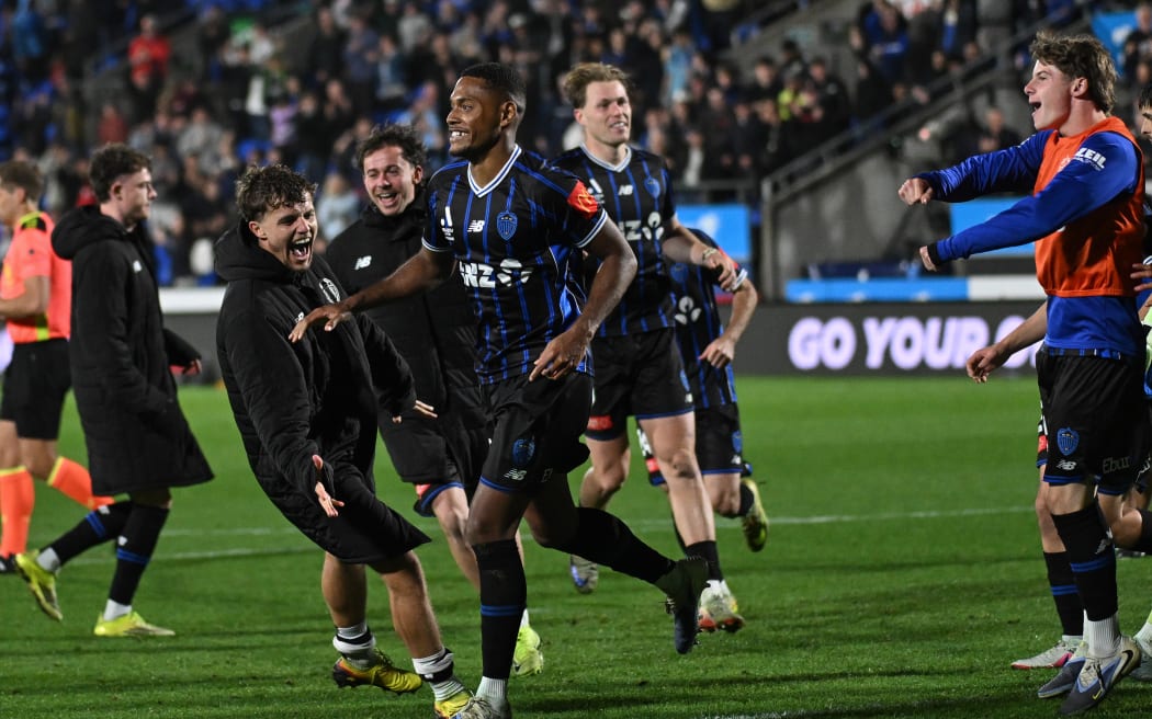 Auckland FC defender Dan Hall (C) celebrates scoring the winning penalty in their A-League elimination final against Melbourne City.