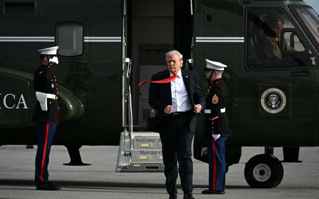 US President Donald Trump steps off Marine One after landing at Ocala International Airport, in Ocala, Florida on May 1, 2026, after giving a speech about taxes and Social Security at The Villages. (Photo by Jim WATSON / AFP)