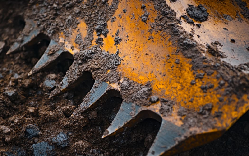Close-up of a metal shovel lying on a pile of soil.
drainage
dirt
earthwork
dig
drain
groundwork
ground
earth
groundcover
water