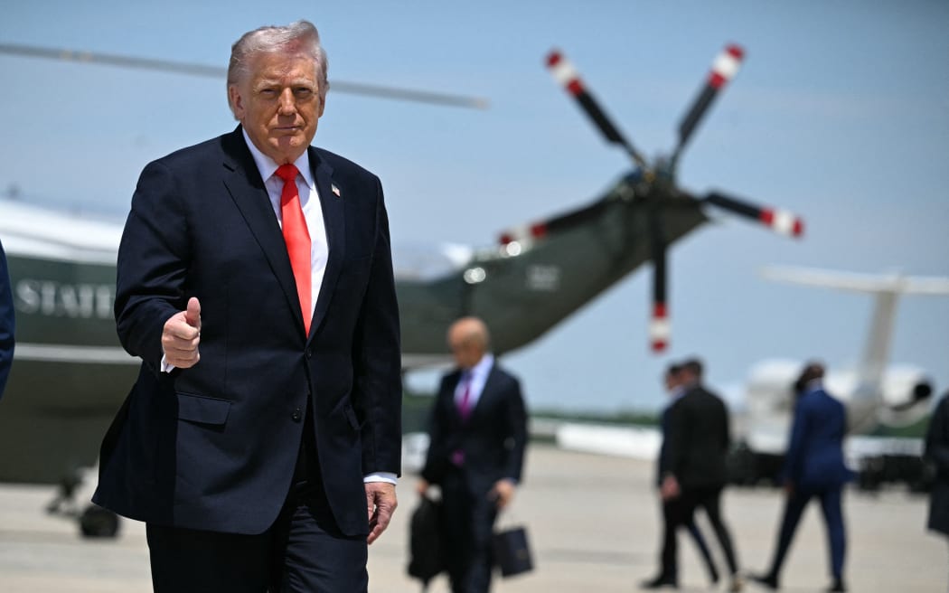 US President Donald Trump flashes a thumbs up while walking to board Air Force One at Joint Base Andrews, Maryland on May 1, 2026. Trump is going to Florida to speak at an event at The Villages and to attend the Forum Club of the Palm Beaches dinner. (Photo by Jim WATSON / AFP)